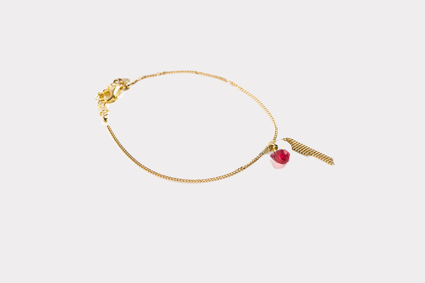 Bracciale con nappina - radice di rubino