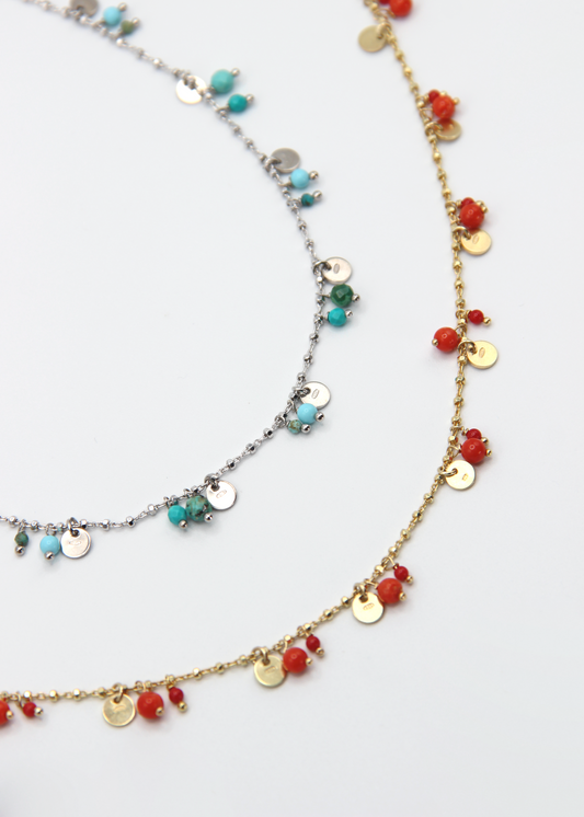 Collana Little Princess Summer Edition Laura Sciunnach nelle varianti turchese e corallo in argento 925. Collana donna artigianale Made in Italy, perfetta per l’estate grazie ai colori vivaci e ai ciondoli luminosi.