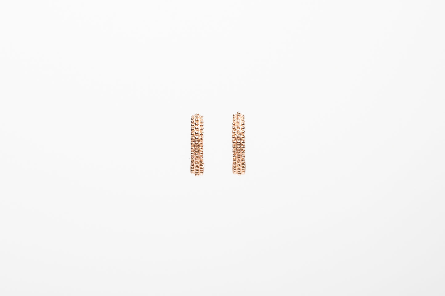 Orecchini a cerchio puntinati in argento placcato oro rosa