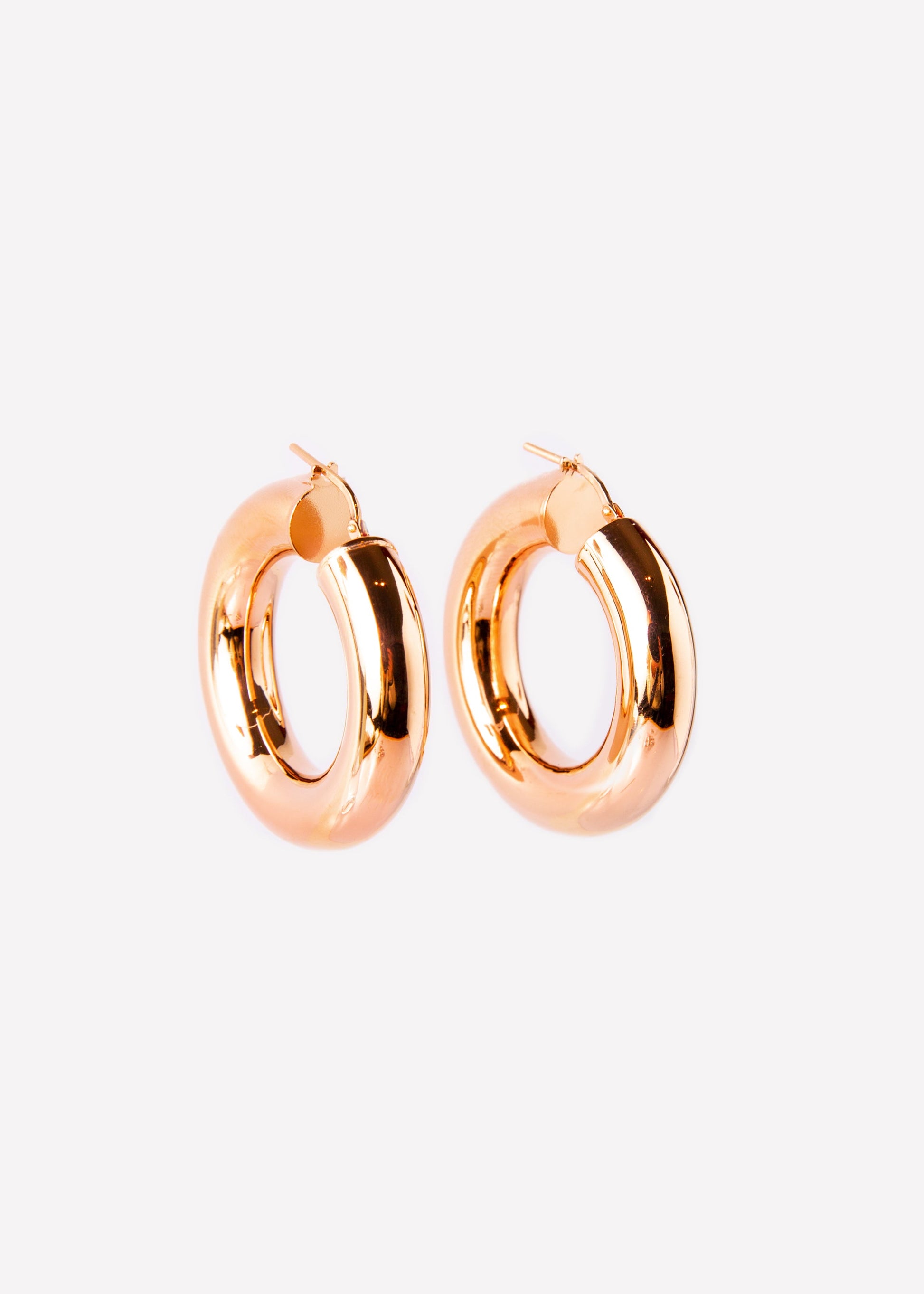 Orecchini a cerchio bombato grande extra bold rosè in argento 925 nickel free, leggeri e luminosi, con chiusura a forcella, design moderno ed elegante da donna.