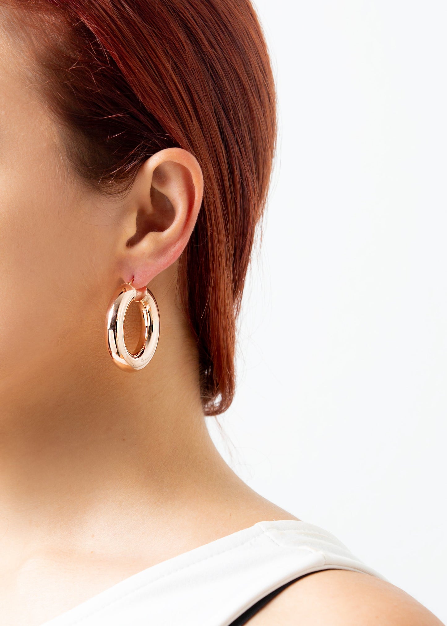Orecchini a cerchio bombato grande extra bold rosè in argento 925 nickel free, leggeri e luminosi, con chiusura a forcella, design moderno ed elegante da donna.